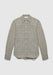 A long-sleeve button-up shirt in a textured gray fabric with a subtle woven pattern, featuring a pointed collar and a relaxed fit, displayed against a plain background.