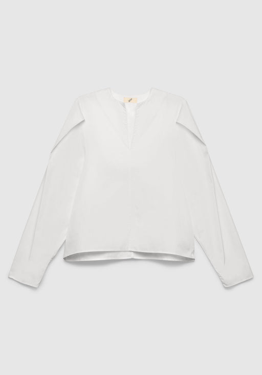 A white long-sleeve blouse with a relaxed fit, featuring a notch neckline and clean, minimal design, displayed against a plain background.