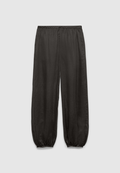 A pair of dark gray relaxed-fit pants with an elastic waistband and gathered cuffs at the ankles, featuring a lightweight, slightly textured fabric, displayed against a plain background.