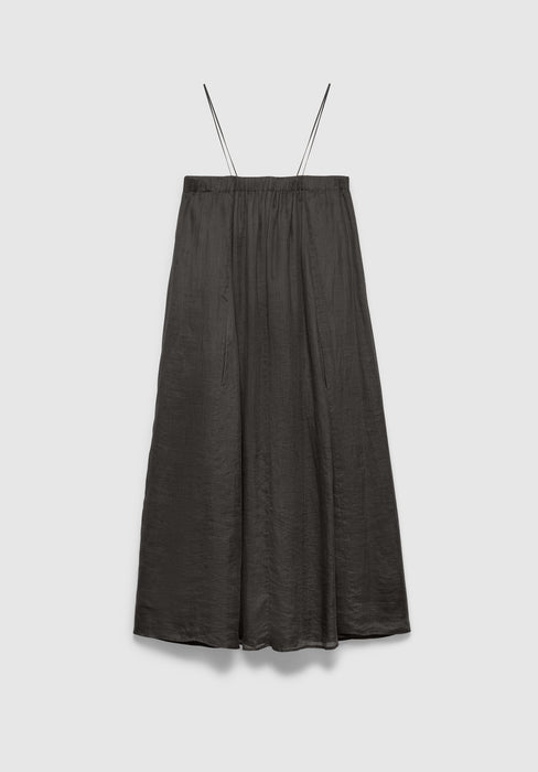 A dark gray midi skirt with a soft, flowy silhouette and a subtle textured finish, featuring thin shoulder straps and a gathered waistband, displayed against a plain background.