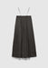A dark gray midi skirt with a soft, flowy silhouette and a subtle textured finish, featuring thin shoulder straps and a gathered waistband, displayed against a plain background.