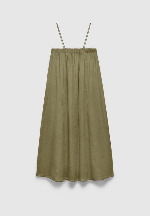 An olive green midi skirt with a lightweight, slightly crinkled texture, featuring a gathered elastic waistband and a loose, flowing silhouette, displayed against a plain background.