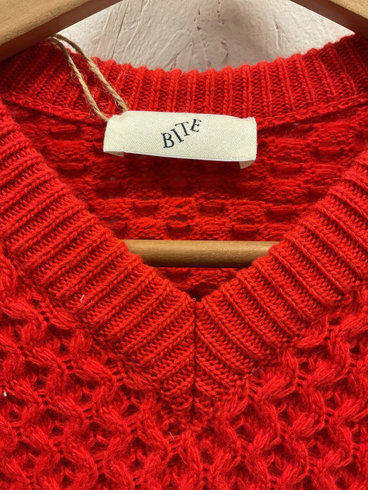 Red asymetric v-neck cable knit sweater