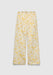 A pair of cream-colored wide-leg pants with a relaxed fit, featuring an elastic waistband with a drawstring and a delicate yellow floral print, displayed against a plain background.