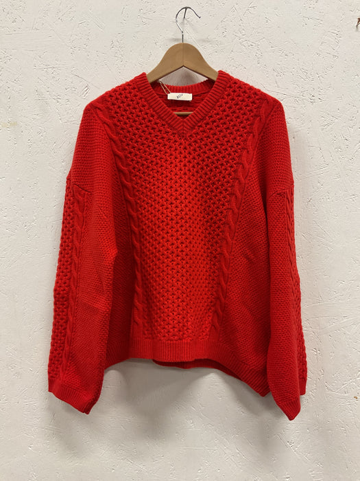 Red asymetric v-neck cable knit sweater