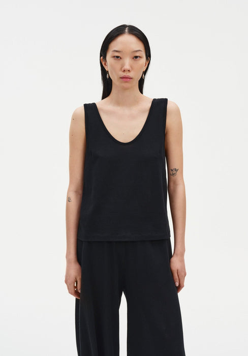 Black sleeveless tank top with a relaxed fit, featuring a scoop neckline and clean, minimal silhouette.