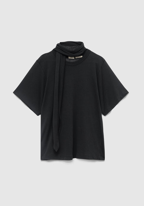 A black short‑sleeved top laid flat on a light gray background, featuring a built‑in scarf detail draped around the neckline.