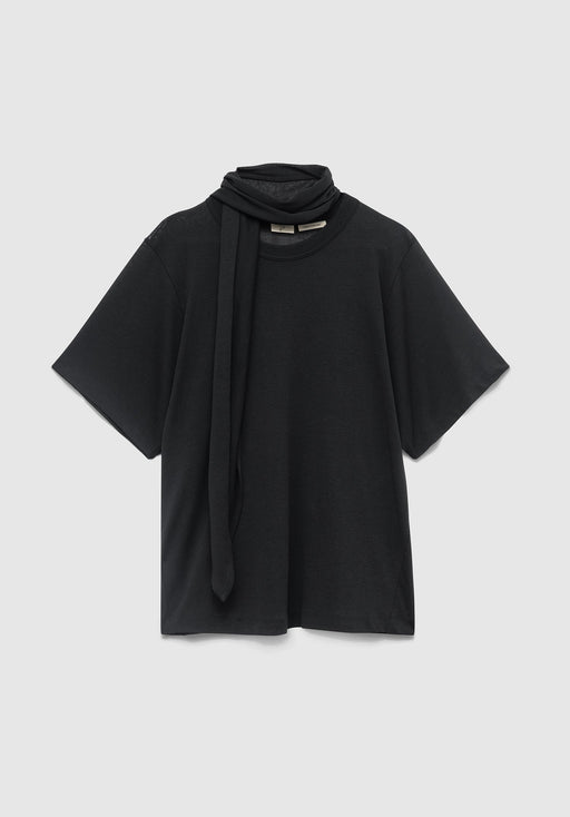 A black short‑sleeved top laid flat on a light gray background, featuring a built‑in scarf detail draped around the neckline.