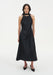 Full-length front view of a model wearing a sleeveless black midi dress with a choker-style neckline and A-line silhouette, paired with black pointed heels.